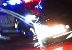 blurry image of a car getting pulled over by a police officer