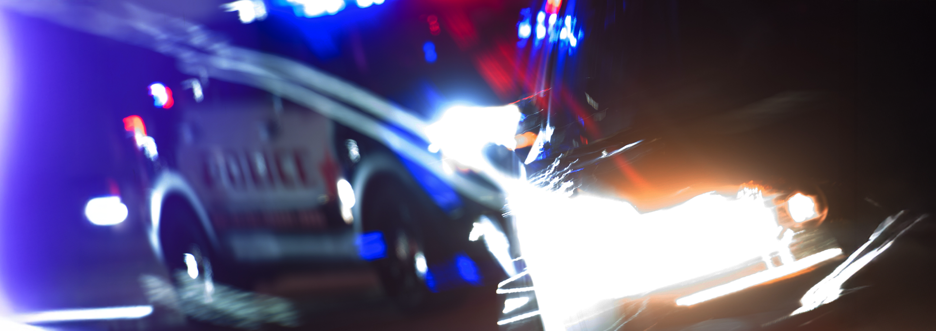 blurry image of a car getting pulled over by a police officer